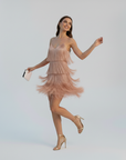 Nude feather mini dress featuring delicate feather detailing and elegant fit