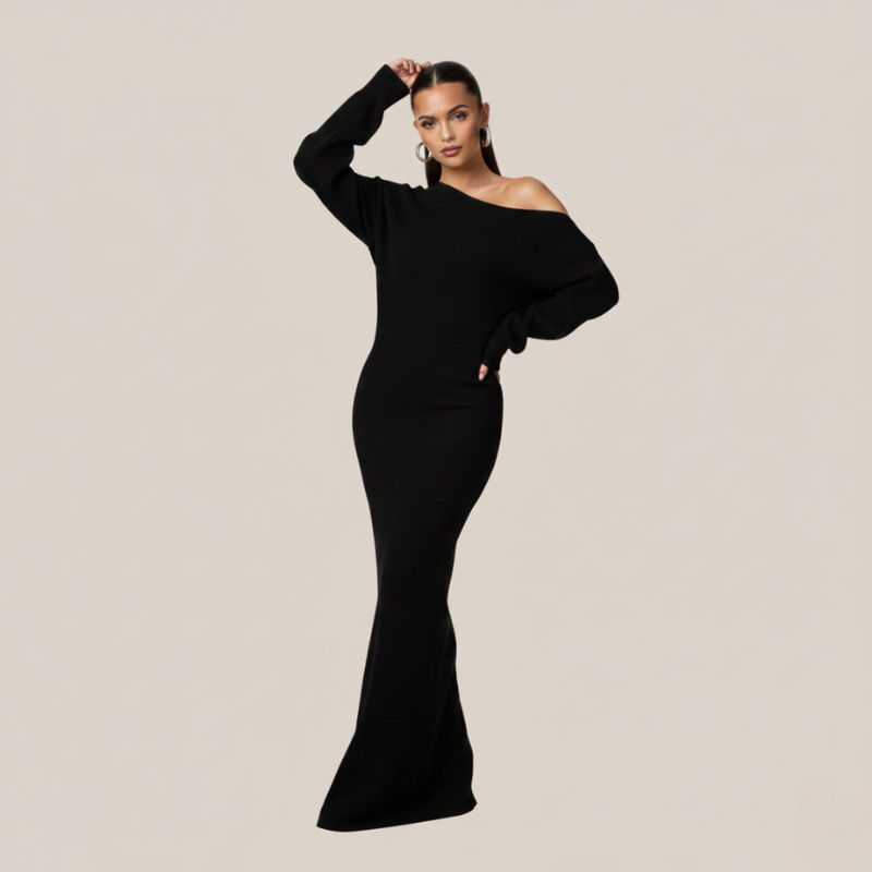 Schwarzes Maxikleid mit weiter Silhouette und eleganter Ausstrahlung, getragen in einer Studioaufnahme.