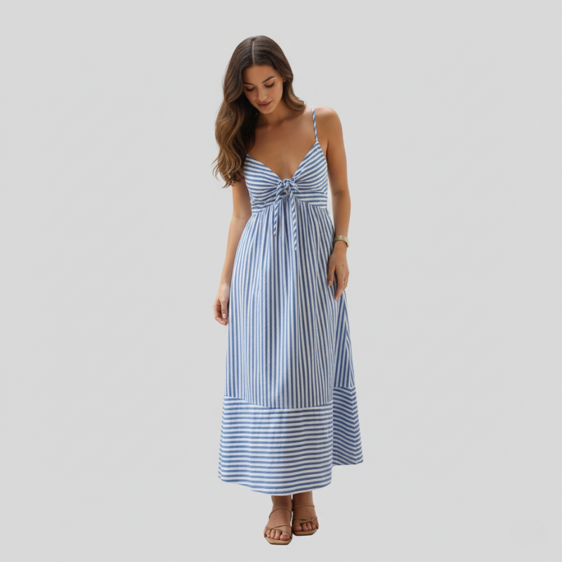 Woman wearing a blue striped midi sundress with a knot-front design and adjustable straps in a clean studio setting.